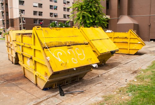 Waste collection truck in West London neighborhood