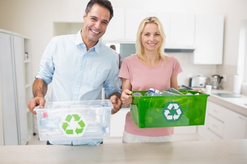 Recycling bins and sorted waste materials