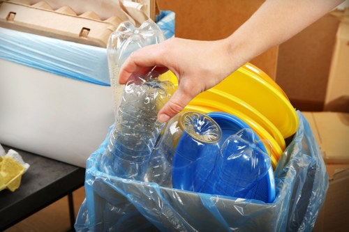 Charity workers collecting donated furniture in West London